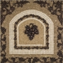 Mosaic tile medallion backsplash of grapes and vines